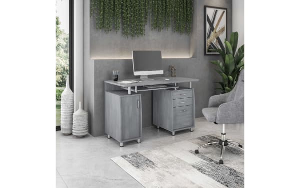 Jenny Gray 2 Drawer Desk in transitional style with gray laminate MDF surface, power-coated steel legs, keyboard tray, storage cabinet with adjustable shelf, and file drawers, designed for organized workspaces and cable management.