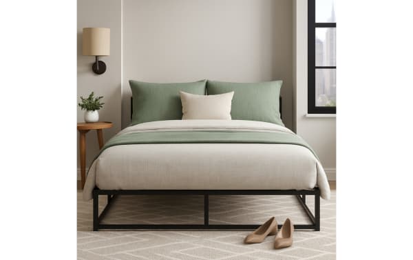 Rhode II Queen Metal Bed Frame in black iron with a transitional style, featuring a sturdy metal slat system and raised profile for under-bed storage.