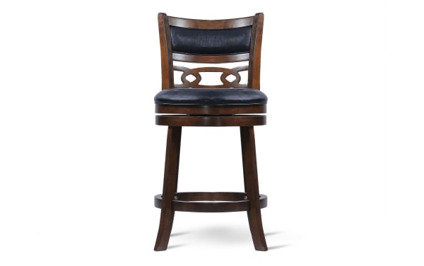 Bar stool with dark wood frame, black cushioned seat and backrest, decorative back slats, and circular footrest, suitable for kitchen or bar seating.