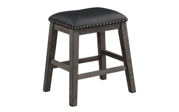 Transitional Polly backless counter height stool with black faux leather seat, nailhead trim, and gray rubberwood legs, designed for casual dining.