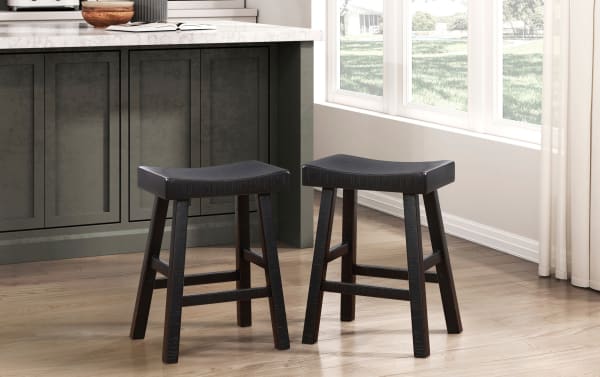 Set of 2 Alicia Black solid wood backless counter height stools in rustic rubberwood with saddle-style seats and subtle rustic accents for kitchen use.