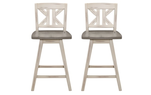 Set of 2 Ryker rustic swivel counter height stools in white and gray, solid rubberwood with distressed finish and divided X-back design.