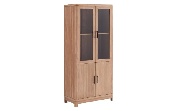Joelle 67.6'' natural wood bookcase with three shelves, ribbed lower doors, tempered glass upper doors, black metal handles, mid-century modern style.