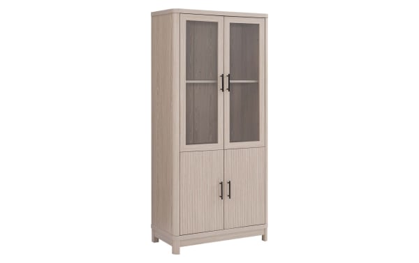 Joelle 67.6'' white oak bookcase with three shelves, ribbed MDF doors, tempered glass panels, black powder-coated metal handles, and splayed legs.