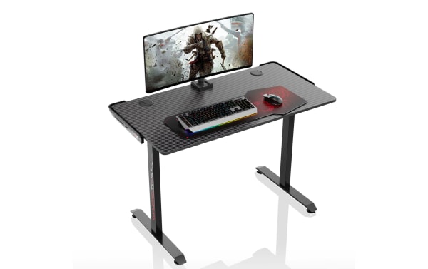 Aurora Black Adjustable Gaming Desk with carbon-fiber textured particle board top, powder-coated metal frame, dual cable management holes, and adjustable height bases.