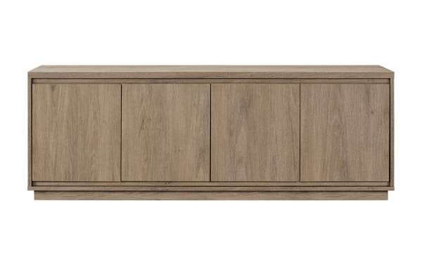 Modern wooden sideboard cabinet in light oak finish with four doors, minimalist design, flat top surface, and recessed base for living room storage.