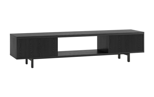 Modern black wooden TV stand with ribbed sliding doors, open central shelf, and metal legs, designed for stylish media storage.