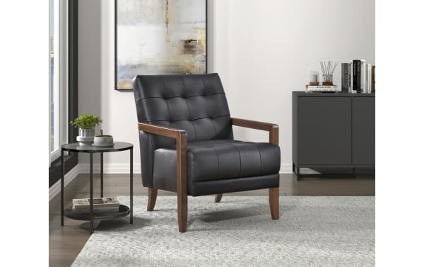 Tenley Black Leather Accent Chair with tufted black leather upholstery, mid-century modern style, solid walnut-finished wood legs, and plush foam cushions.