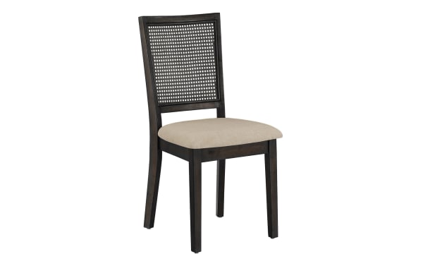 Transitional Brandi dining chair set of 2 with beige fabric upholstered foam seat, black rubberwood frame, and rattan panel back for bohemian style.
