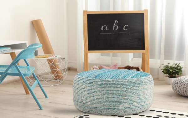 Dani Aqua Pouf in mid-century modern style with aqua and white woven wool and cotton fabric, serving as a textured footrest or extra seat.