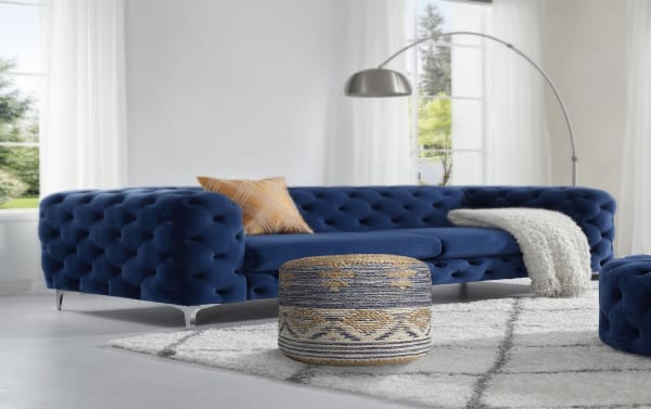 Bohemian Sadie Natural and Navy Pouf in navy, natural, and gray jute and cotton, featuring geometric patterns and textured fringe trim for seating or footrest.
