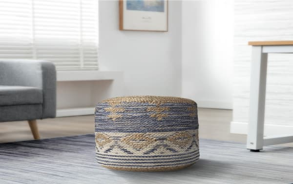 Sadie Natural and Navy Pouf in bohemian style, handcrafted with navy, natural, and gray jute and cotton fabric, featuring textured woven patterns and fringe trim.