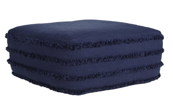 Thea Navy Pouf in contemporary style, navy blue cotton fabric with textured fringe detailing, sturdy square floor cushion for living rooms or bedrooms.