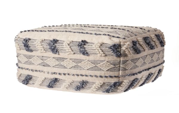 Transitional Koda Navy Pouf in navy and ivory, handcrafted wool and cotton blend with textured geometric patterns, ideal as footrest or extra seat.