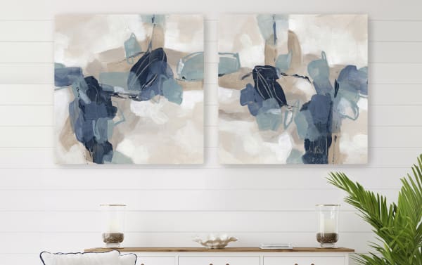 Abstract wall art set featuring two square canvases with blue, beige, and white brushstrokes, perfect for modern living room decor.