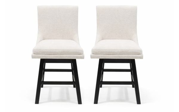 Pair of modern swivel dining chairs with cream-colored upholstered seats and backs, featuring black wooden legs and footrests.