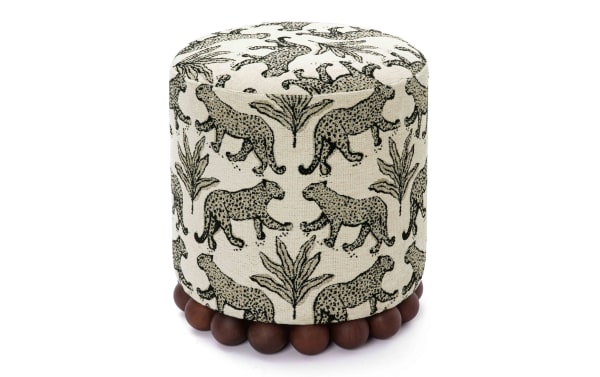 Addyson Cream Leopard Ottoman with black leopard print on cream polyester fabric, contemporary style, solid rubberwood orb base, sturdy and decorative footrest or extra seating.