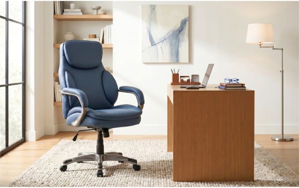 Nyx Blue Adjustable Swivel Office Chair in blue faux leather with memory foam padding, metal base, and smooth-rolling nylon casters, ideal for home office.