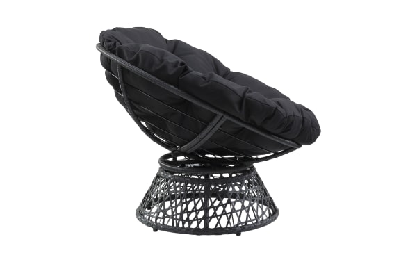Black papasan chair with a round, woven rattan frame and thick, cushioned seat in soft fabric, designed for comfortable lounging.