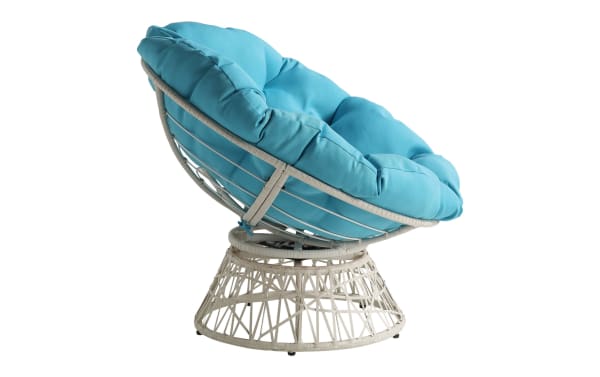 Round papasan chair with a white rattan frame and plush turquoise cushion, designed for comfortable indoor or outdoor seating.