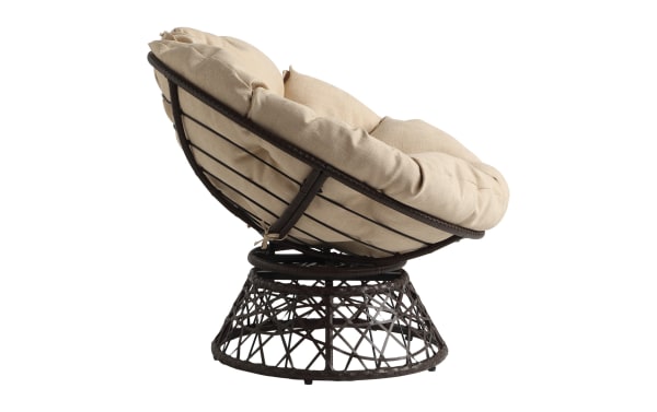 Round swivel papasan chair with black metal frame and beige tufted cushion, designed for comfortable indoor or outdoor seating.