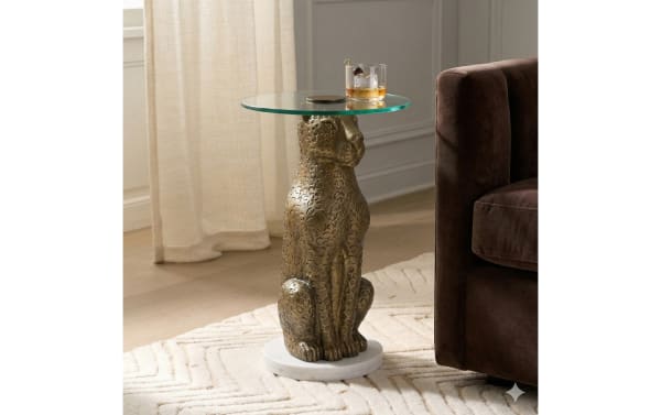 Zanzibar Antique Gold Round Accent Table with glass top, sculptural gold aluminum base, and white marble bottom in transitional style.