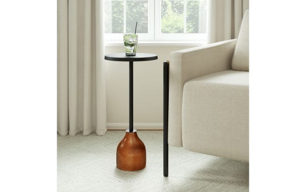 Morant Black & Brown Round Accent Table with solid mango wood pedestal base, black metal top and iron stem, perfect for living rooms or bedrooms.