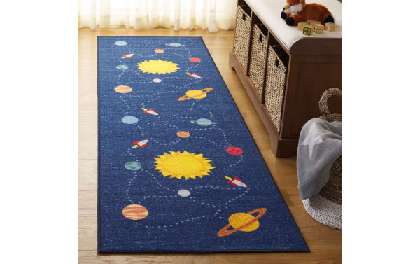 Navy blue Orbit Adventure 2' x 6' runner rug with playful solar system design, durable synthetic polyamide fabric, and easy-care washable finish.