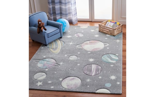 Cosmic Galaxy 3' x 5' gray transitional rug with playful planets and stars pattern, made of durable polypropylene and polyester blend.