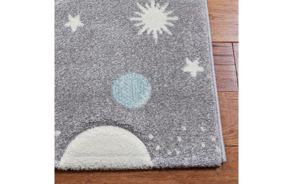 Cosmic Galaxy 3' x 5' gray transitional rug with playful planets and stars pattern, made of durable polypropylene and polyester blend.