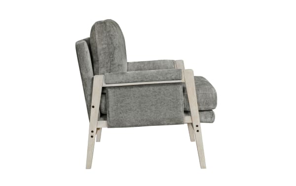 Mid-century modern armchair with light gray fabric upholstery and whitewashed wooden frame, featuring cushioned seat and backrest for living room seating.