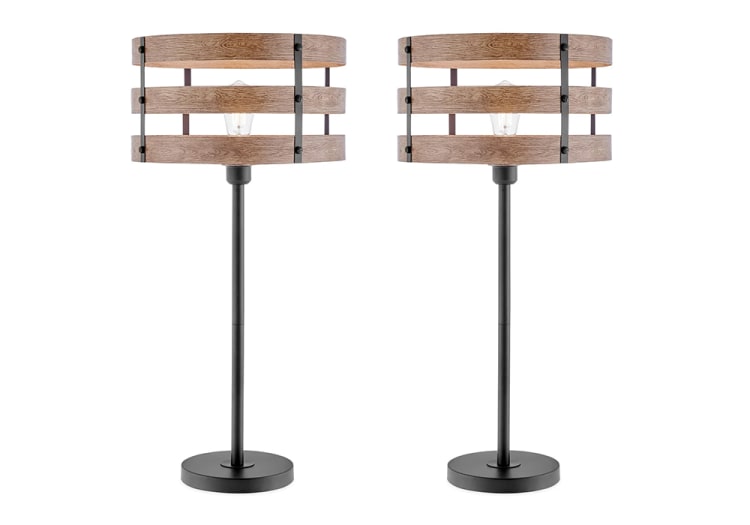 Pair of modern table lamps with black metal bases and wooden slat drum shades, featuring exposed vintage-style Edison bulbs for rustic decor.
