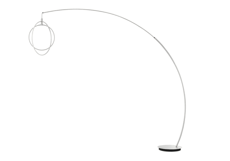 Modern arc floor lamp with a sleek silver metal frame, circular base, and intertwined ring LED light fixture, ideal for contemporary living spaces.