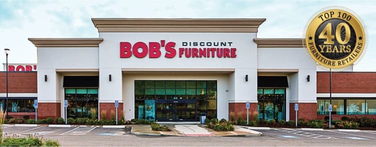 Bob's Discount Furniture storefront with large red and black signage, featuring a 40 years Top 100 Furniture Retailers gold emblem.