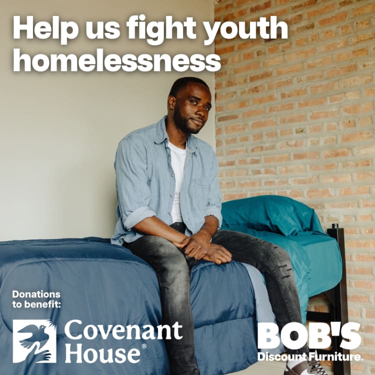 Help us fight youth homelessness. Donations to benefit Covenant House. BOB'S Discount Furniture logo on image with young man sitting on blue bed in casual clothes against brick wall.