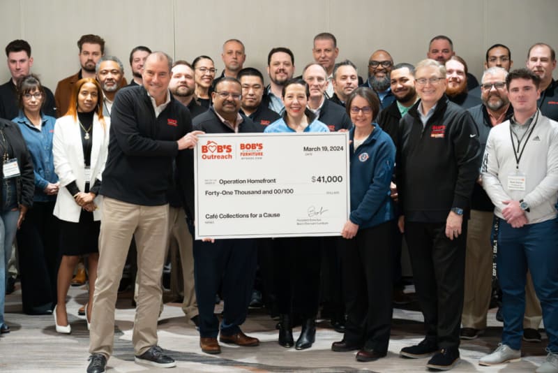 Group of people holding a large check from Bob's Outreach for $41,000 dated March 19, 2024, donated to Operation Homefront for Café Collections for a Cause.
