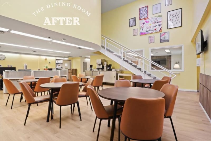 The dining room features modern round wooden tables with tan leather chairs on light wood flooring, yellow walls, a staircase, wall art, and a mounted TV. Text reads: "THE DINING ROOM AFTER."