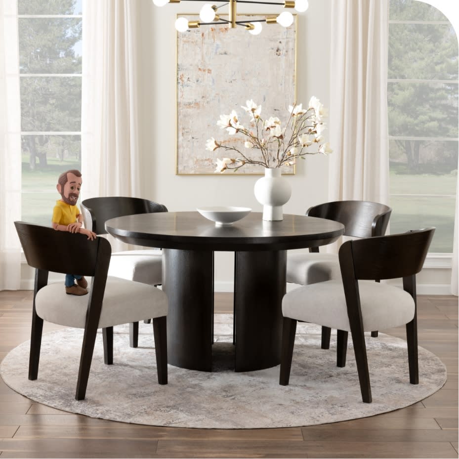 Dark brown dining table with 4 brown and beige upholstered chairs with Little Bob standing on one.