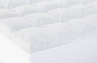 White tufted plush mattress topper