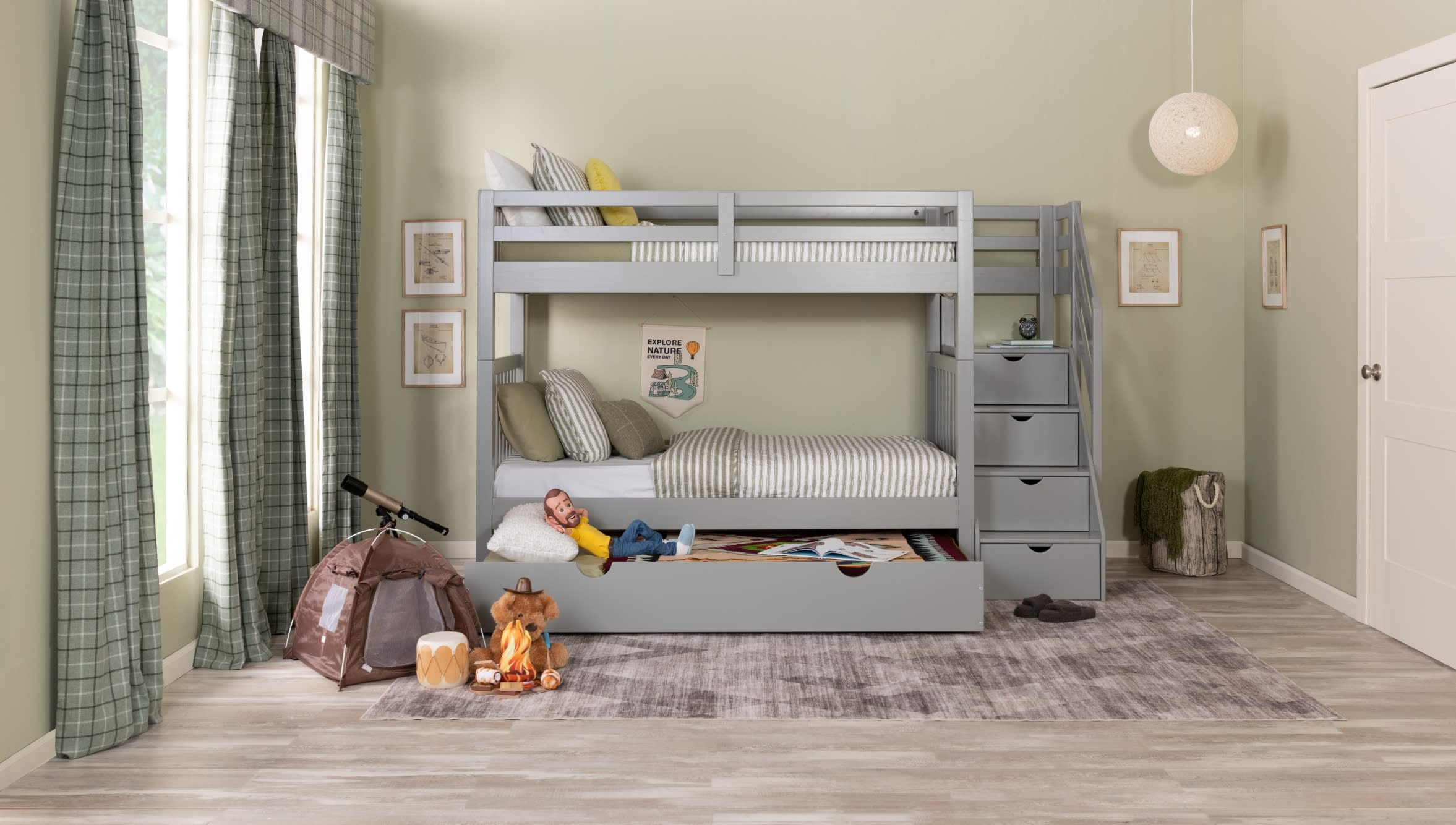 Gray twin size bunk bed with trundle bed and staircase storage centered on a gray abstract rug.