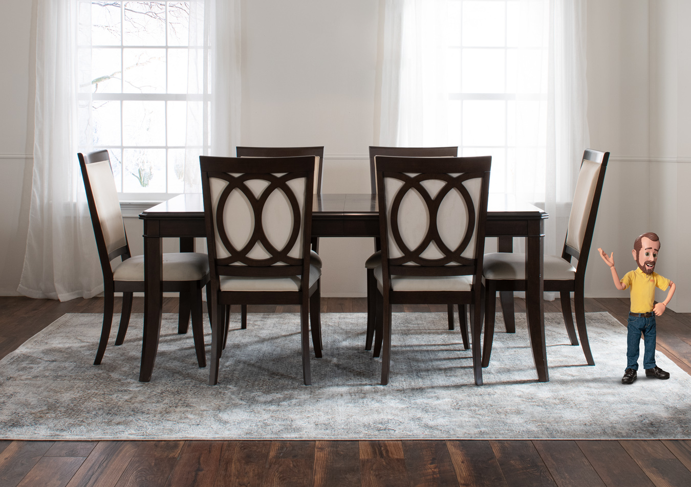 Dining room with brown rectangular dining table with 6 brown and beige upholstered dining chairs, and a blue and beige abstract rug.