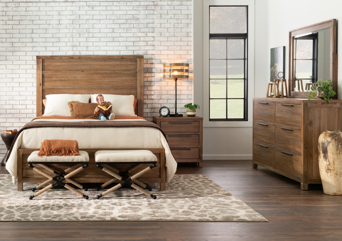 Transitional white with cherry trim and black hardware bedroom set with storage bed and 2 drawer nightstand, atop a brown ikat rug with reading stool.