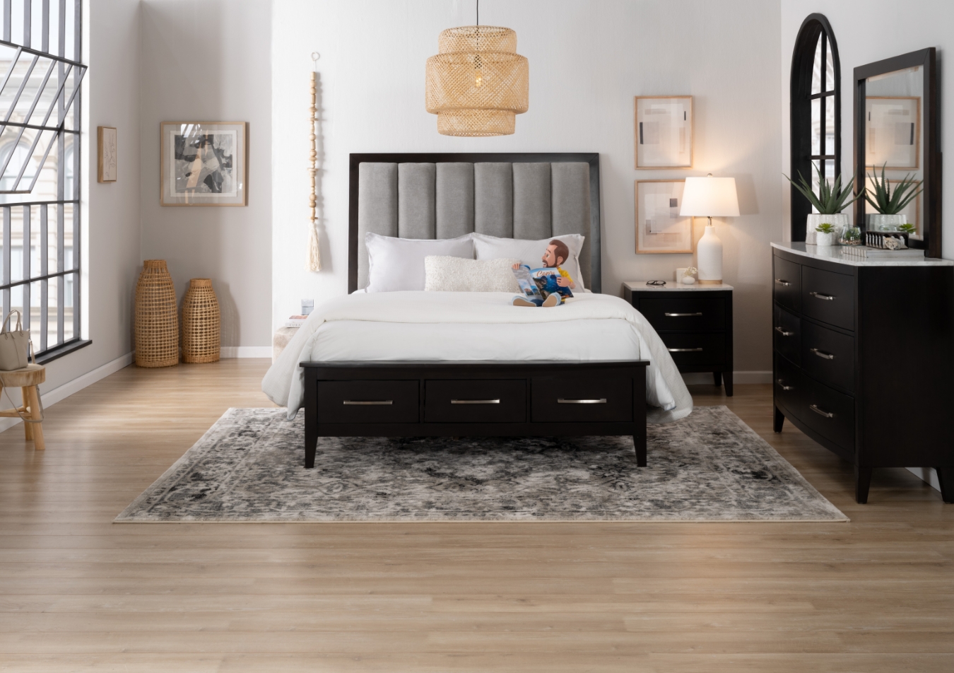 "Contemporary bedroom set in espresso with silver hardware with white quartz tops, featuring a storage bed with a gray upholstered headboard, 2 drawer nightstand with white lamp on top, and 6 drawer dresser with mirror	"