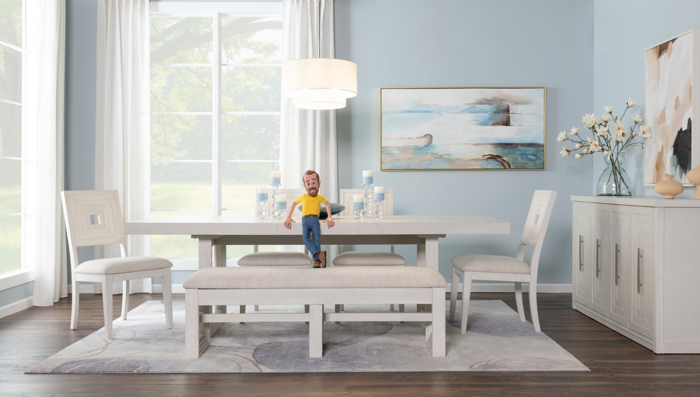Contempory dining room set showcasing an extendable table, four upholstered panel back chairs, and upholstered bench, against a light blue wall with ceiling high window, wooden floor, and white area rug, with a white four drawer server on the side.