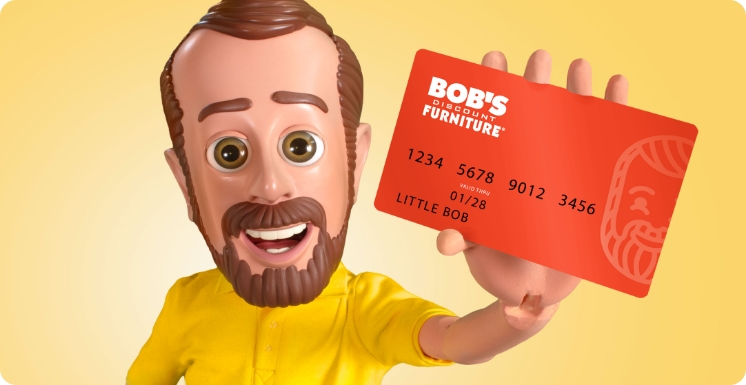 Character holding a Bob's Furniture credit card