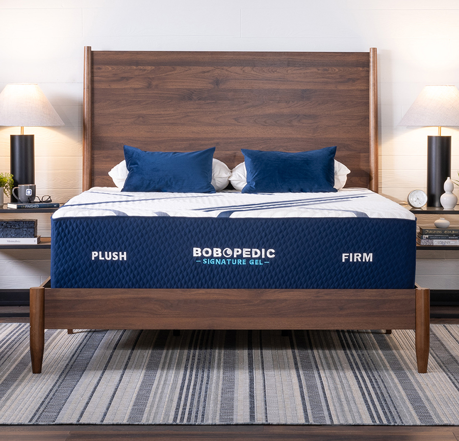 White and gray mattress with plush on the left side and firm on the right