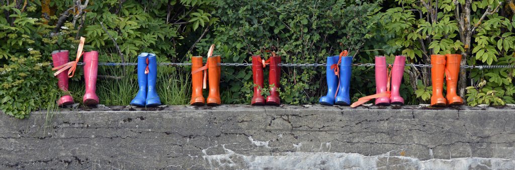 Rubber boots on a wall Put some boots on the ground to get the most out of your hyperlocal real estate marketing strategy. 