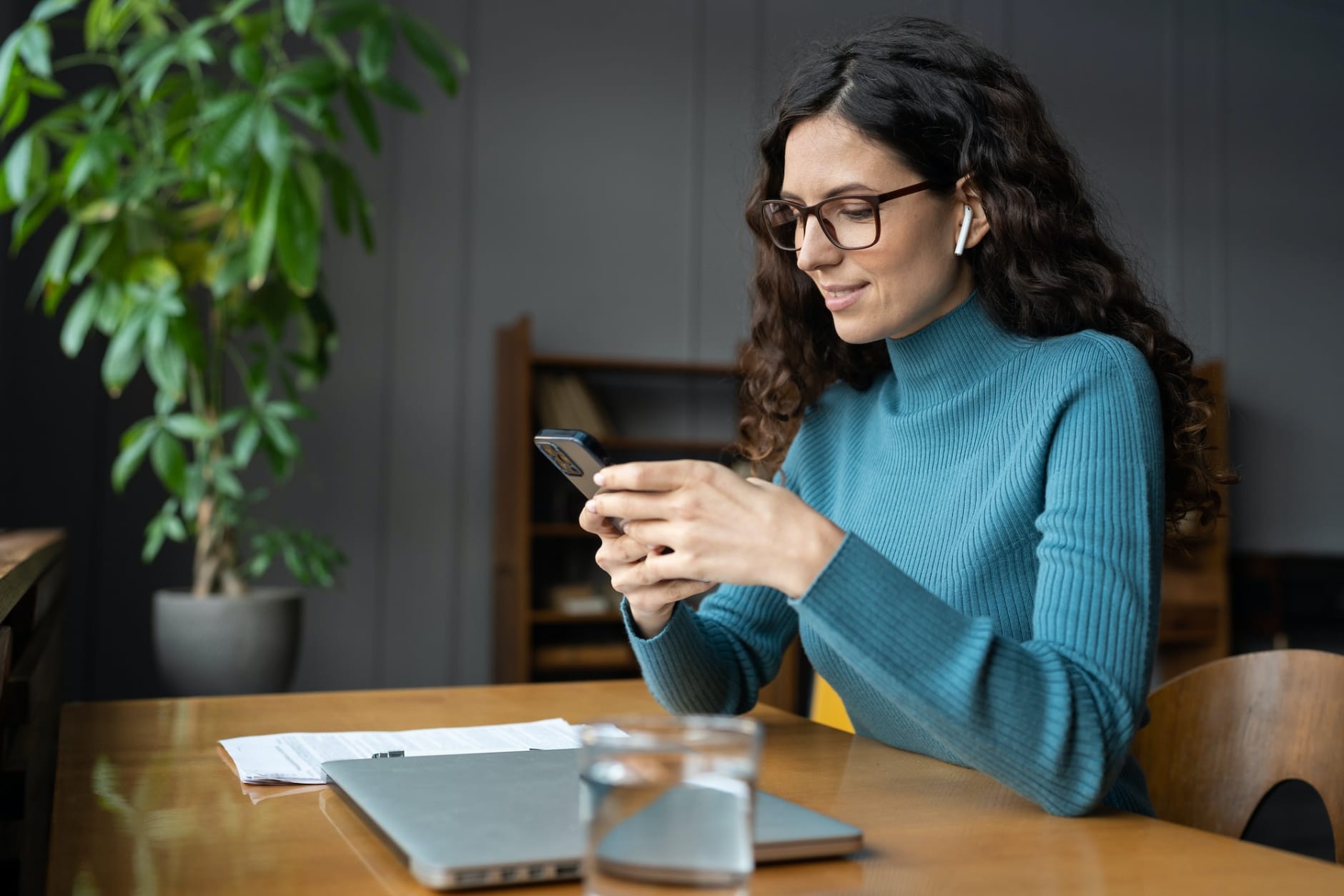 Young businesswoman check notification on smartphone online apps for social media management and ads