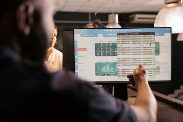 Financial analyst analyzing trading stock market using analytics app