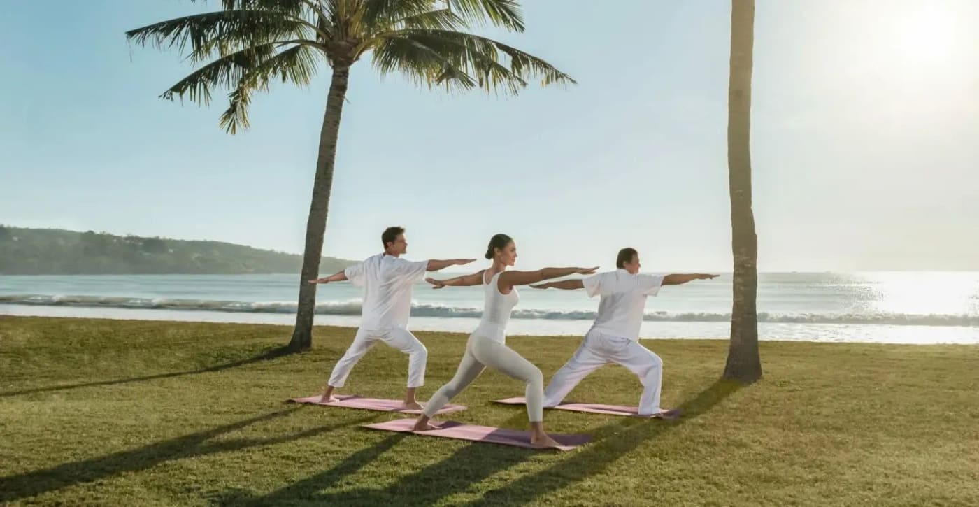 Yoga session on the lawn facing the beach at the InterContinental Bali Resort